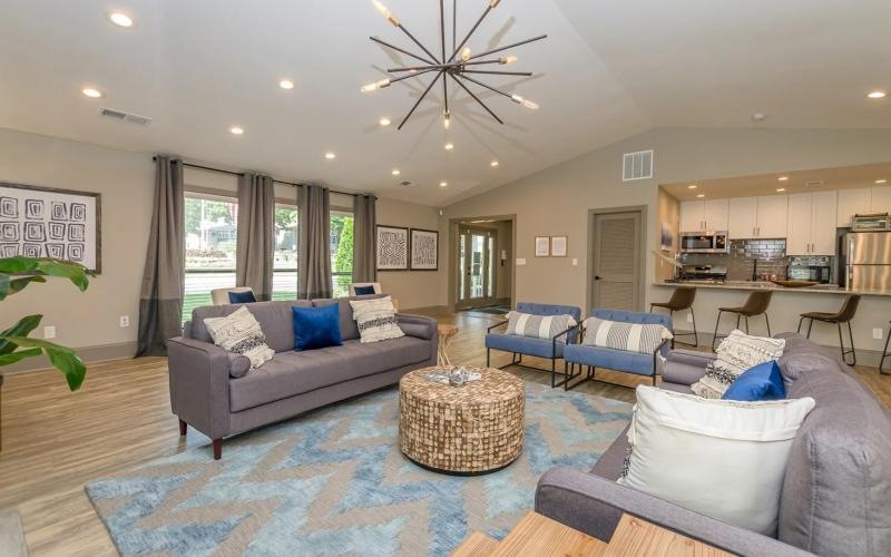 a clubroom with couches and chairs