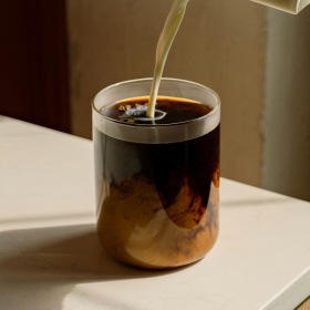 a person pouring coffee