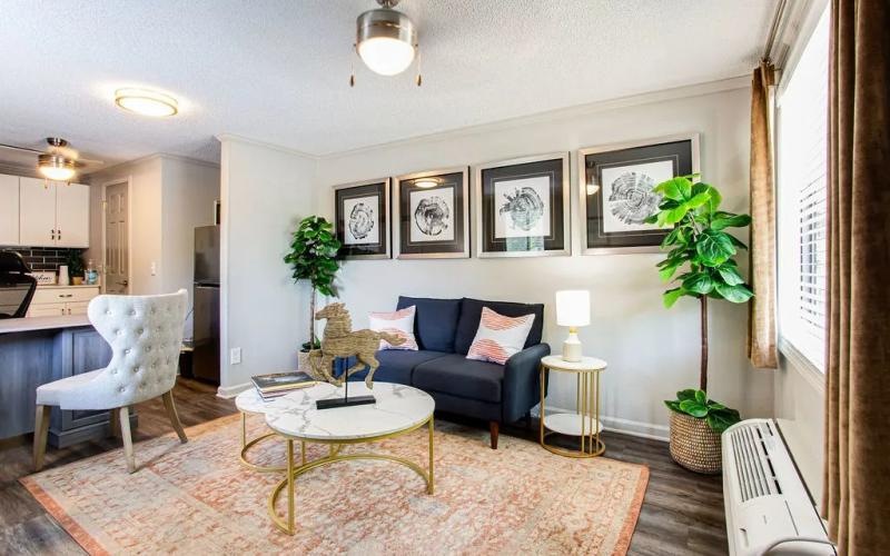 a living room with a couch and a table