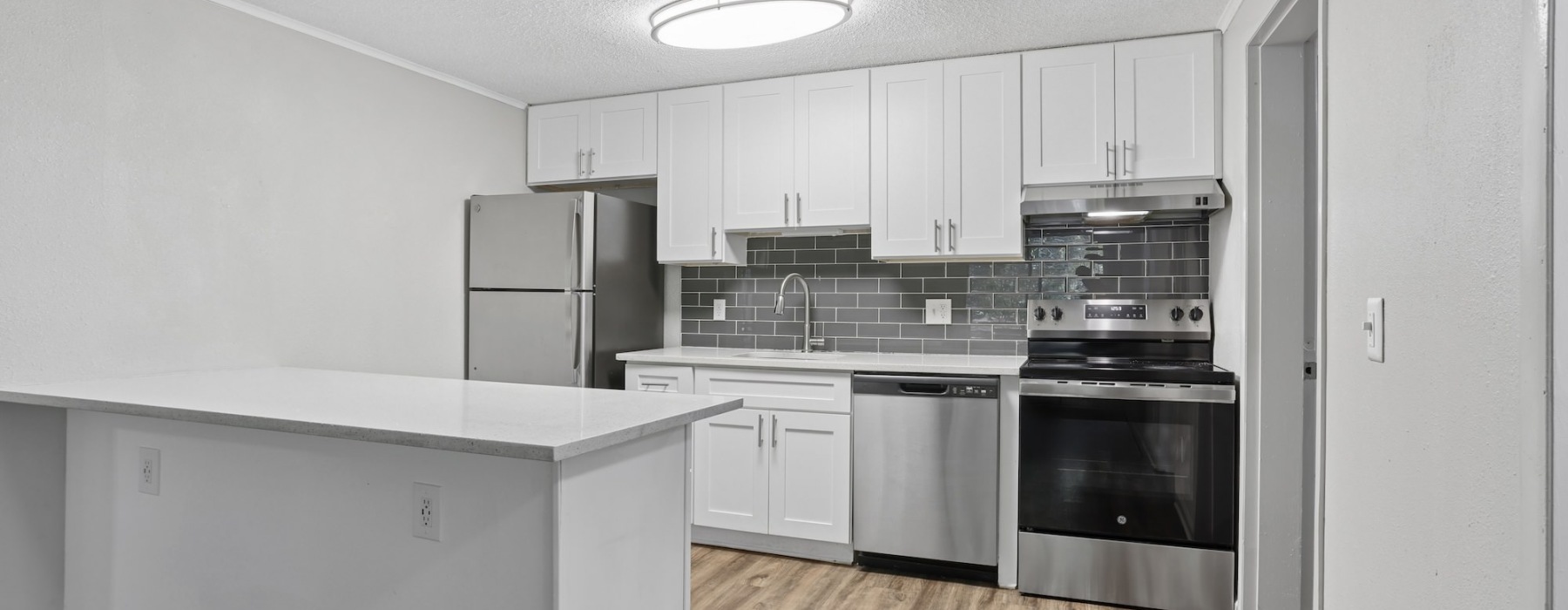 Well-lit kitchen with ample counter space
