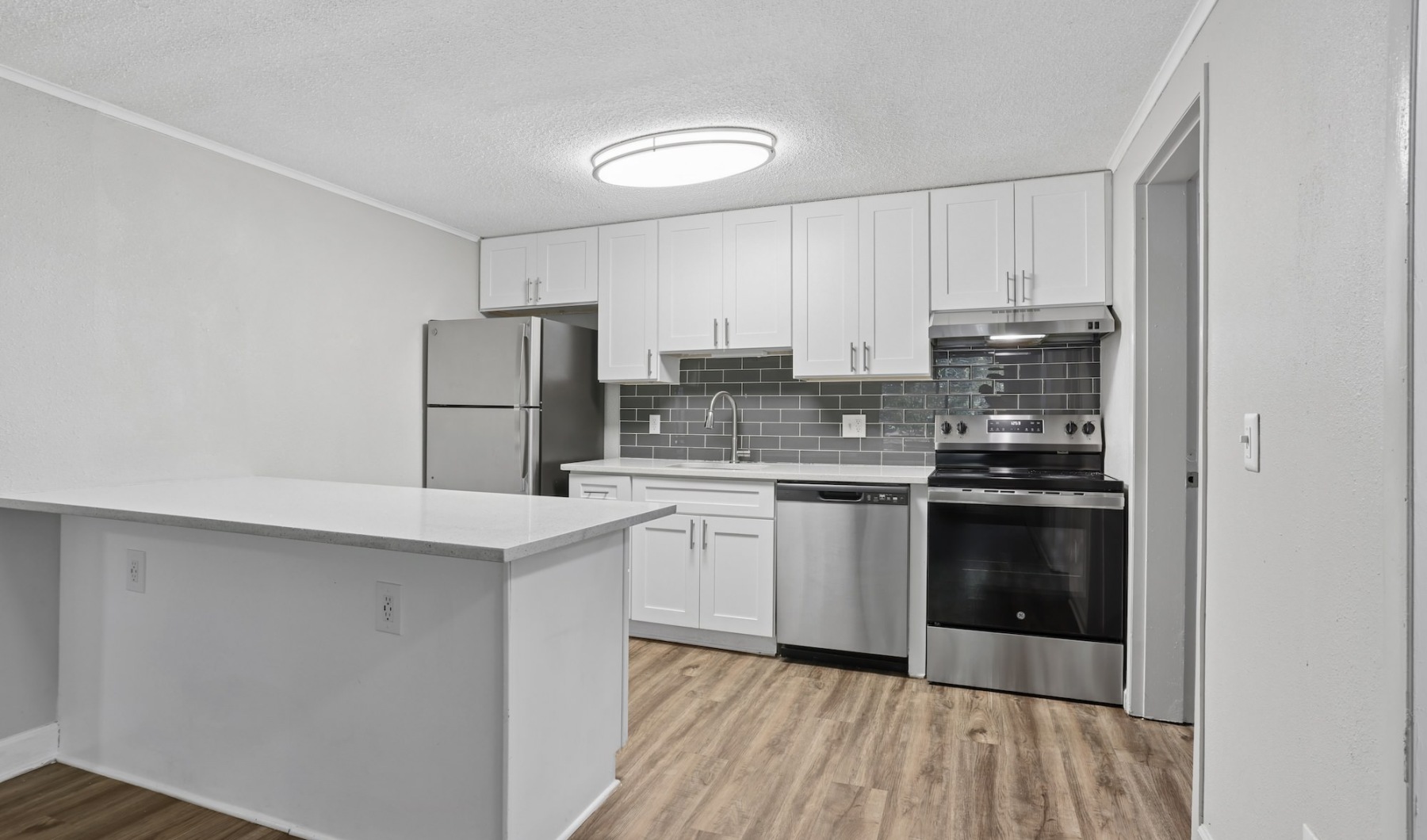 Well-lit kitchen with ample counter space